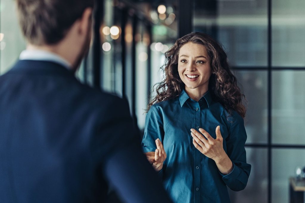 Businesswoman and businessman talking in the office
